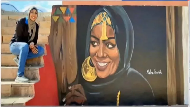 إبداع نوبي يزين جداريات أسوان ويبرز دور المرأة النوبية  ( فيديو)